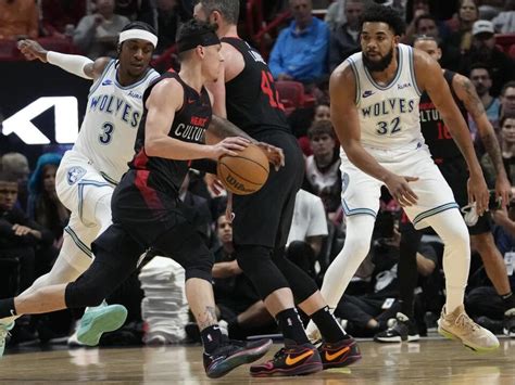 Edwards scores 32, Wolves rally from 17 down to beat Heat 112-108 and improve to 20-5